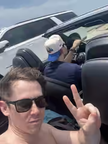 Convertible road-trip selfie in bright Florida sun